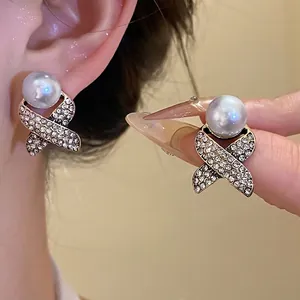 French vintage criss-cross earrings with pearl and rhinestone inlay details