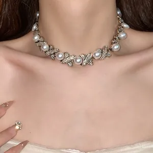 Close-up of vintage French style necklace with rhinestones and pearls on a model