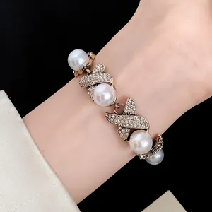 Close-up of a vintage French style pearl and rhinestone bracelet from a jewelry set