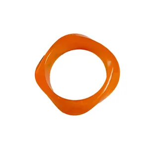 Stylish retro orange acrylic irregular bangle with a modern minimalist design for women