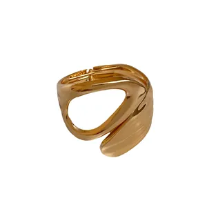 Stylish minimalist irregular geometric hollowed-out open bangle with a luxury gold finish