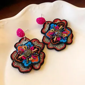 Vintage handmade embroidered flower earrings with colorful beads and sparkly rhinestones
