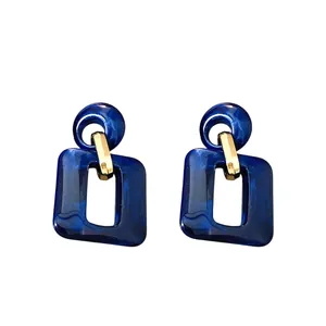 Elegant geometric deep blue marbled acrylic drop earrings with polished gold accents