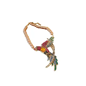 Vintage court style necklace with colorful rhinestone bird pendant and faux pearls