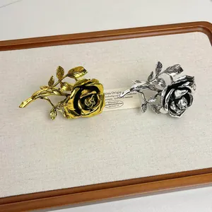 Detailed macro view of vintage-style rose rings featuring exquisite gold and silver finishes