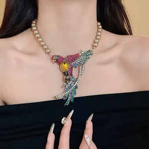 Vintage court style rhinestone bird wing pendant necklace with artificial pearls on model