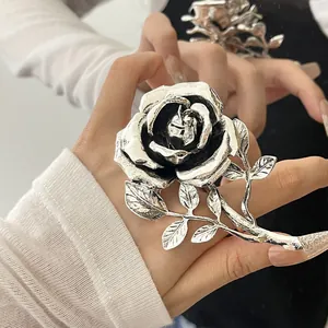 Large vintage silver rose ring with intricate petal details and antique black finish.