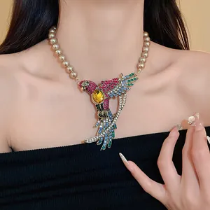 Close-up of a vintage court style choker with a colorful crystal bird and faux pearls