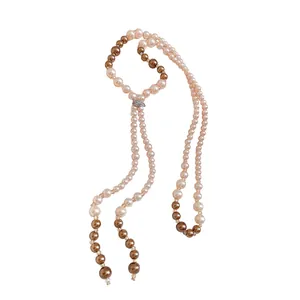 Elegant long tassel pearl necklace featuring a pavé-set slider in French luxury style