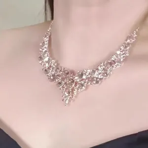 Close-up of elegant teardrop necklace with sparkling rhinestones on model's neck