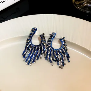Elegant blue and silver rhinestone tassel earrings with geometric C-shape design
