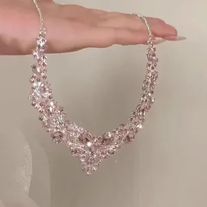 Macro view of a sparkling pink teardrop crystal necklace with elegant rhinestone detail