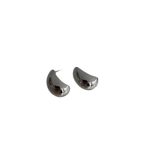Minimalist silver teardrop stud earrings with a high-polished metallic finish for daily wear