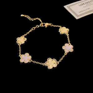Detailed view of luxury gold plated flower bracelet featuring pearlescent shell inlays