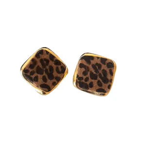 Vintage square leopard print stud earrings with golden metal frame and flocked texture