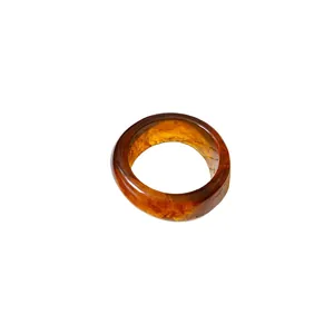 Elegant retro amber resin bangle with irregular design and translucent texture detail
