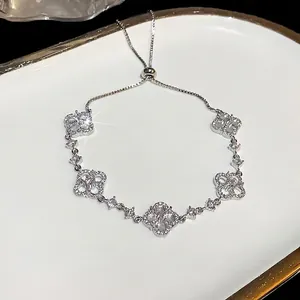 Sparkling zircon hollow flower charm bracelet with adjustable slider chain for women