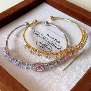 Elegant minimalist zircon geometric open bangle bracelet with a pink oval centerpiece stone