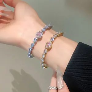 Elegant open bangle bracelets featuring oval pink cubic zirconia and sparkling accents