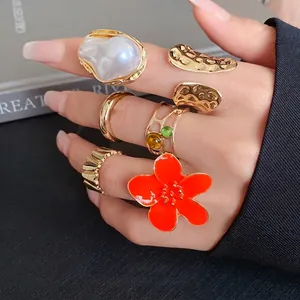Stylish gold-tone geometric irregular open ring set with pearl and floral accents