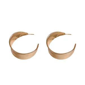 Elegant rose gold C-shaped hoop earrings with a smooth polished finish for women