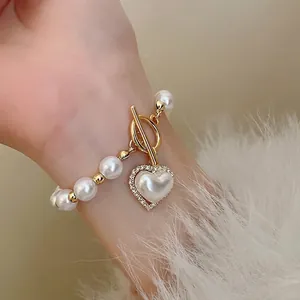 Élégant bracelet en perles vintage avec pendentif cœur et fermoir en or pour femmes