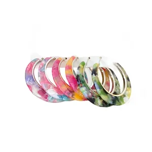 Stylish set of marbled acetate hoop earrings with colorful retro patterns and silver pins
