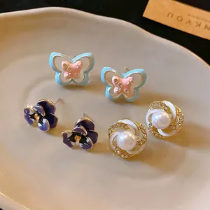 Set of 3 elegant enamel floral and butterfly stud earrings with rhinestones