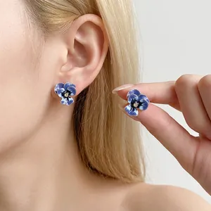 Elegant blue enamel flower stud earrings with central rhinestone in vintage style for women