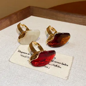 Chunky oval resin open rings set with gold plated metal for elegant fashion jewelry