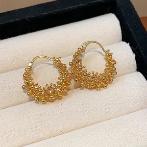Elegant 18k gold plated hollow round hoop earrings with a unique granulated beaded texture