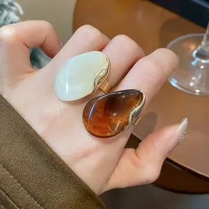 Chunky vintage resin oval open ring for women in elegant white and amber tones