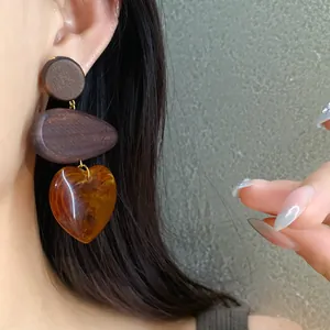 Vintage dark wood heart drop earrings with amber resin pendant and silver needles
