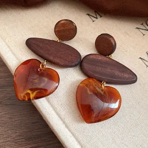 Handmade ethnic style wooden heart drop earrings with amber resin pendant for women
