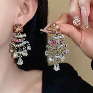 Vintage silver needle crystal tassel earrings featuring teardrop rhinestone accents