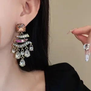 Close-up of vintage tassel earrings with sparkling rhinestones and colorful crystals
