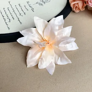 Detailed close-up view of a vintage cream lily flower hair clip with delicate petal textures