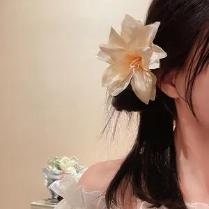Vintage lily flower hair clip shown on model hair for a romantic forest fairy look