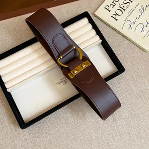 Vintage style wide brown leather belt with decorative gold rivet buckle for women