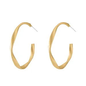 Elegant matte gold twisted geometric hoop earrings with silver needles for women