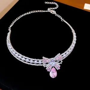 Detailed view of a pink butterfly zircon choker with pearls and sparkly rhinestones.