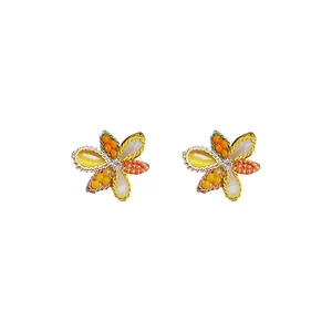 Handmade floral crystal bead stud earrings with silver needles on a clean white background