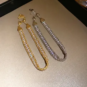 Luxury vintage wrapped chain bracelet with glittering rhinestones in gold and silver tones.