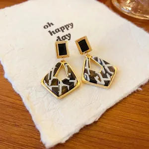 Elegant S925 silver needle geometric hollow earrings with a marble pattern inlay