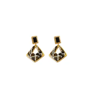 Geometric hollow diamond drop earrings with black accent and tortoiseshell pattern