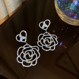 Exquisite heart and hollow rose drop earrings featuring full sparkling rhinestone inlay