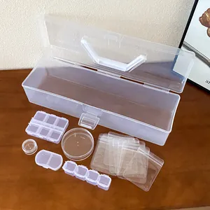 Detailed view of transparent plastic storage set with boxes and small seal bags