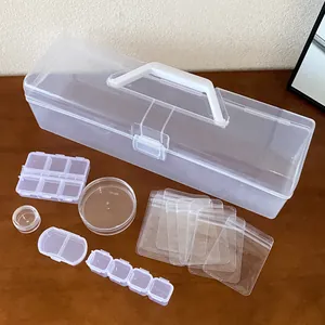 Close-up showing various sizes of clear plastic organizers included in the storage set