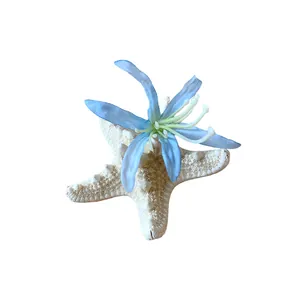 Exquisite starfish hair clip featuring a delicate blue fabric flower for beach vacations
