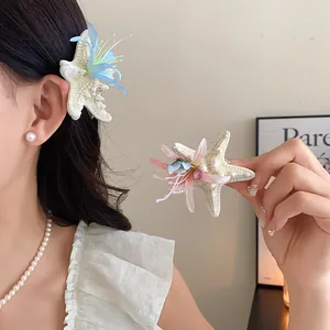 Close-up of starfish flower hair clips with fabric textures and bead accents